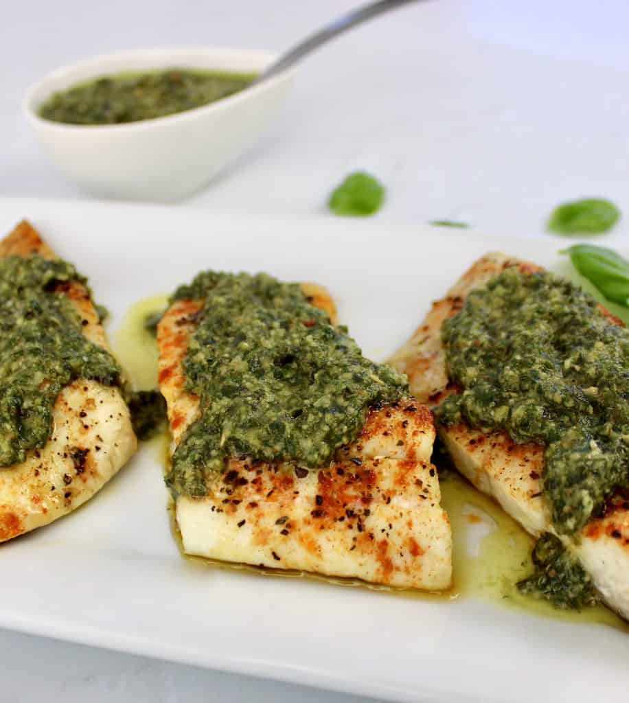 3 pieces of snapper with pesto sauce on top