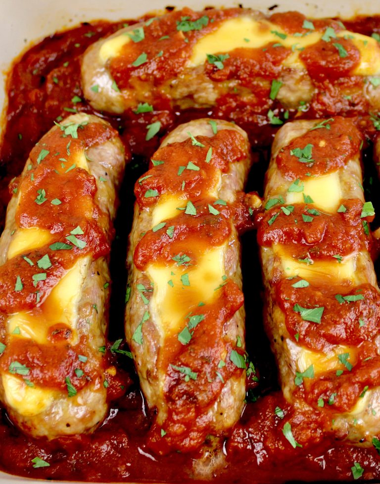 4 Cheese Stuffed Italian Sausage in baking dish with parsley garnish