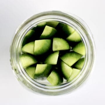 overhead view of cucumber spears in mason jar