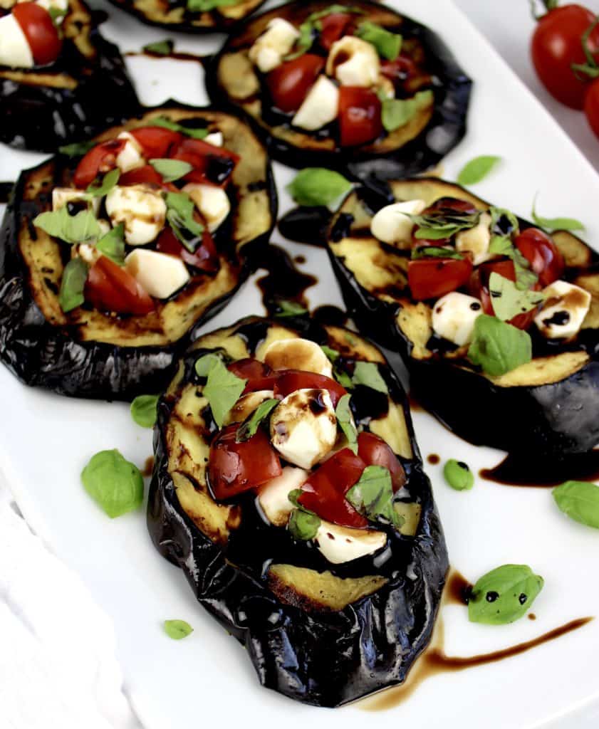 slices of grilled eggplant with mozzarella tomatoes and basil with balsamic drizzled