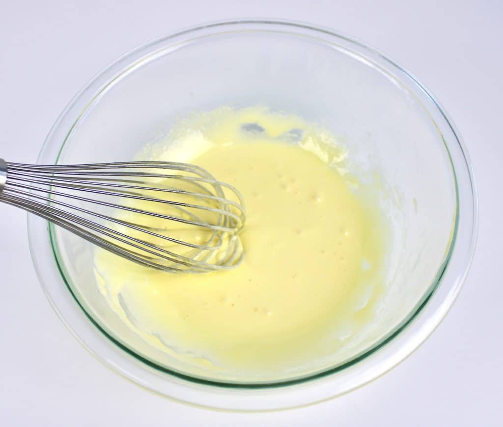 egg yolks and sweetener whisked in glass bowl