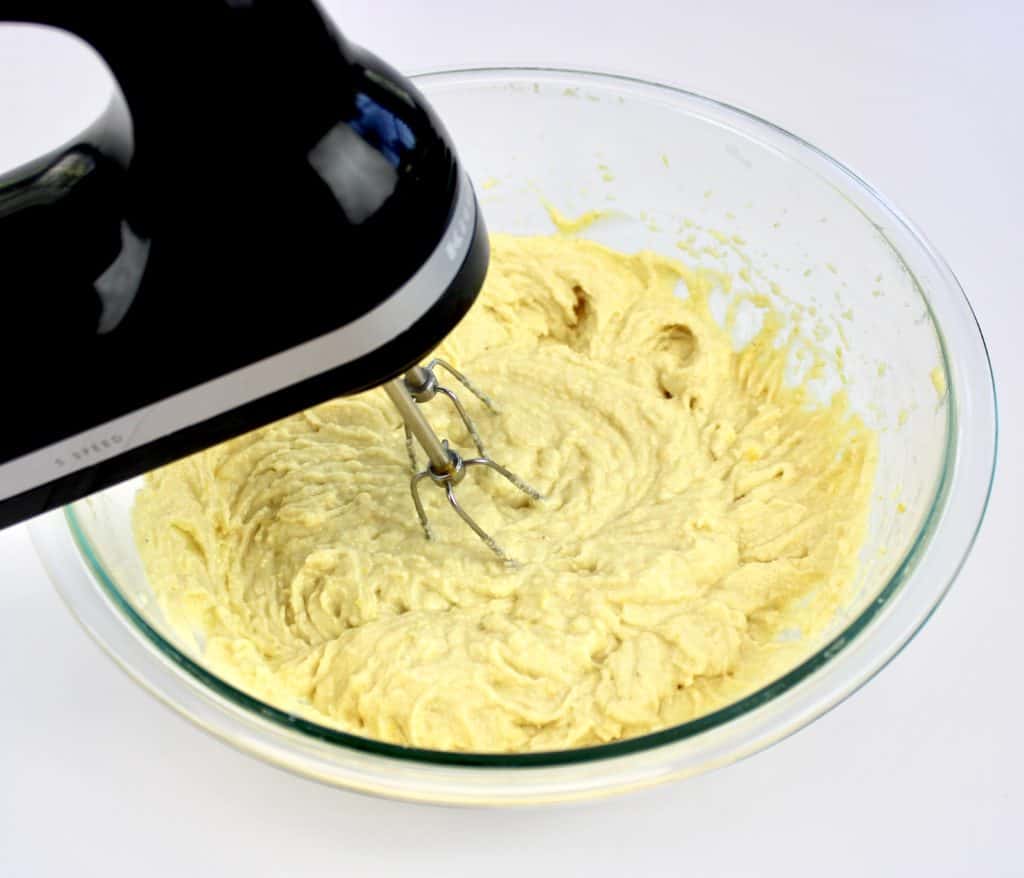 lemon ricotta cake batter being mixed with hand mixer