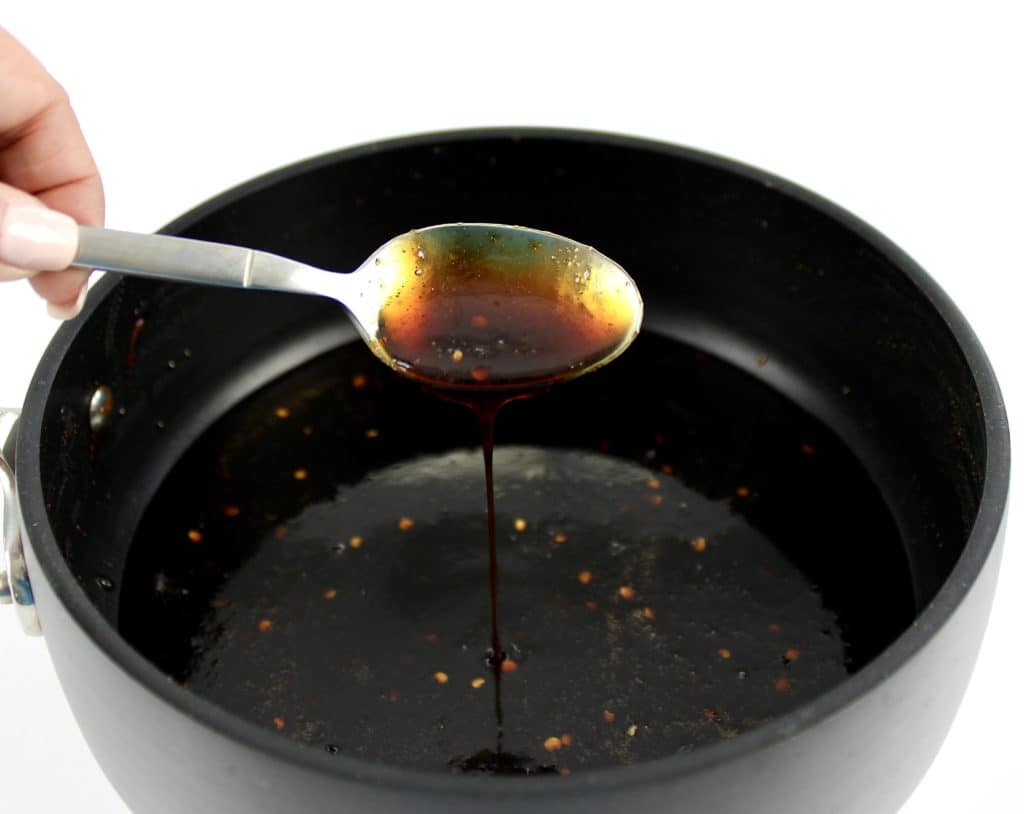 Keto Teriyaki Sauce being spooned out of saucepan