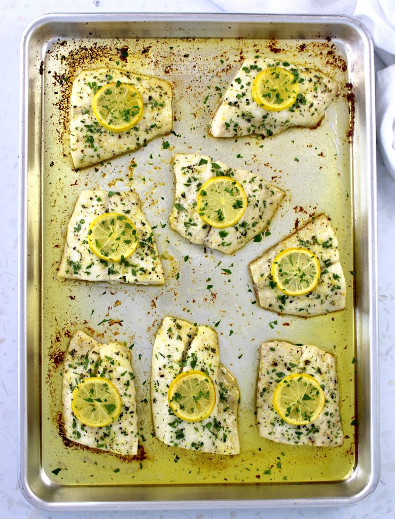 8 pieces of Baked Red Snapper with Compound Butter and lemon slices on top