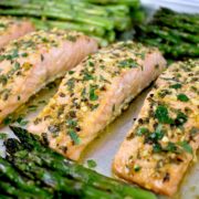 salmon on sheet pan with asparagus with garlic and chopped herbs