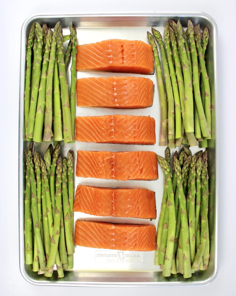 6 pieces of salmon and 4 bunches of asparagus on sheet pan