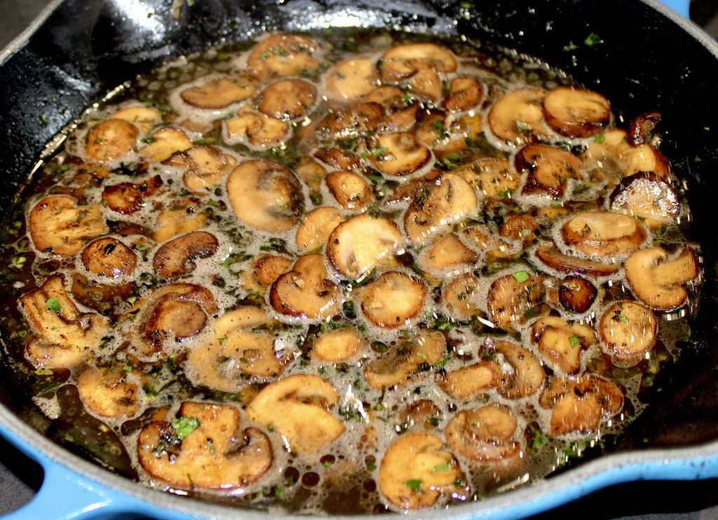 mushrooms in skillet with white wine