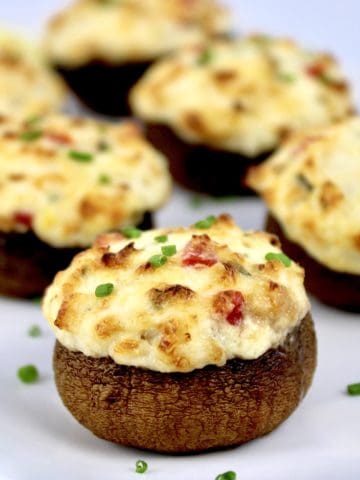 Crab Stuffed Mushroom closeup with chopped chives garnish