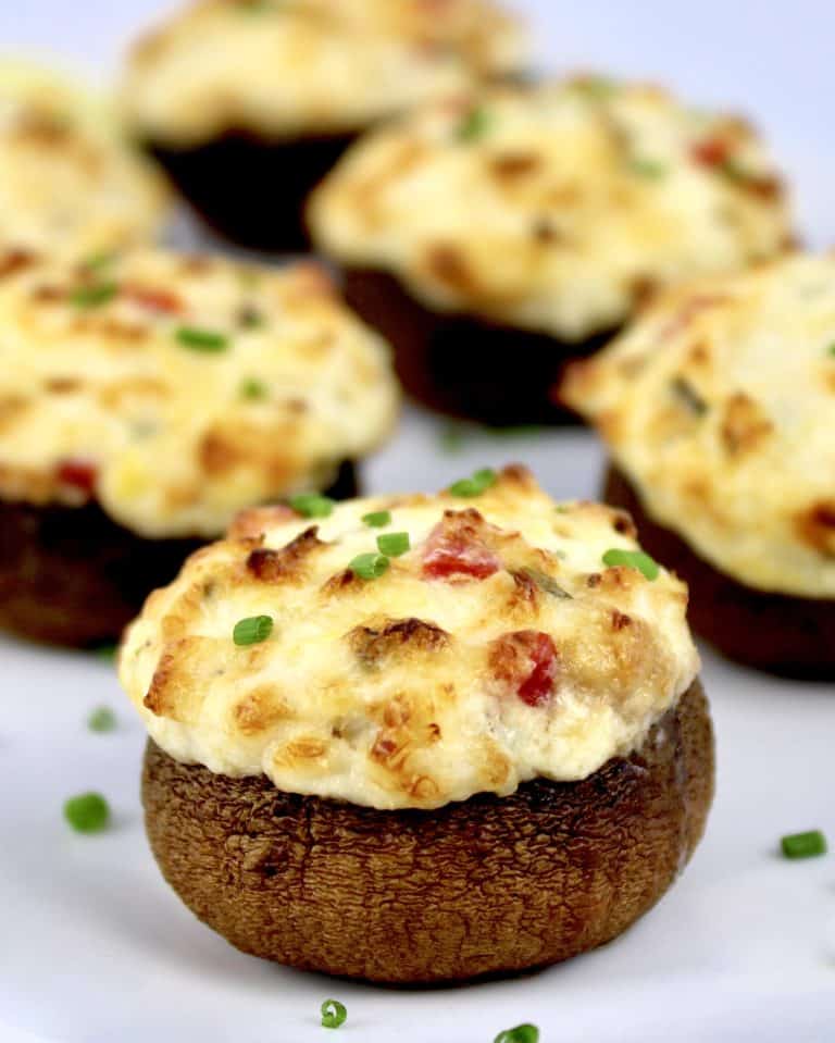 Crab Stuffed Mushroom closeup with chopped chives garnish