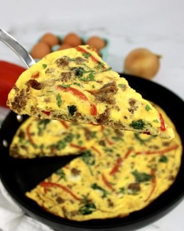 slice of frittata being held up