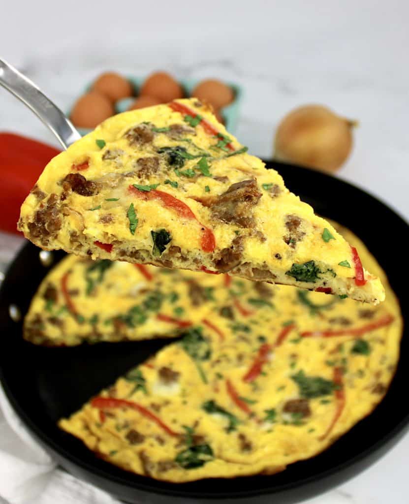 slice of frittata being held up