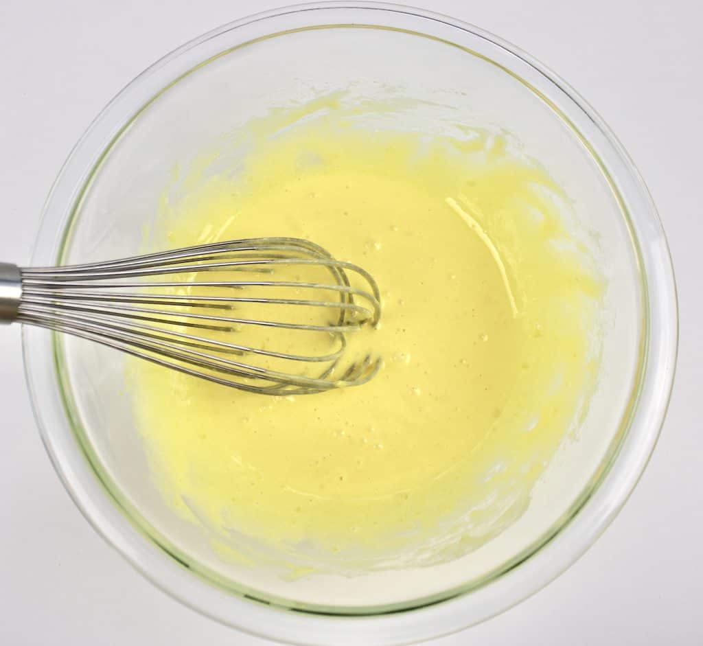 egg yolks whisked with sweetener in glass bowl