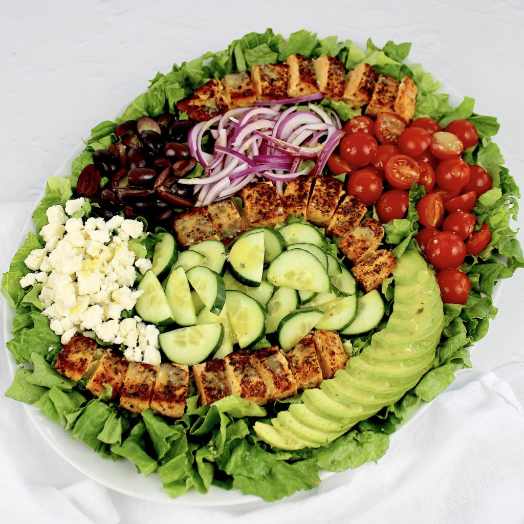 overhead view of salmon salad with sliced veggies