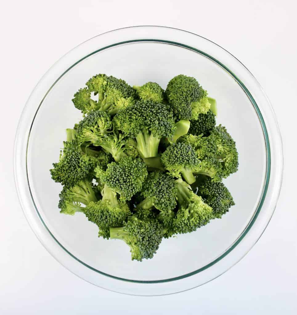 glass bowl with broccoli florets in it