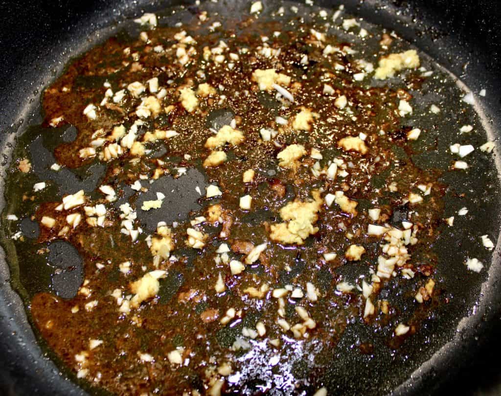 garlic and ginger sautéed in skillet