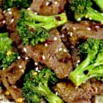 closeup of Beef and Broccoli with red pepper flakes on top