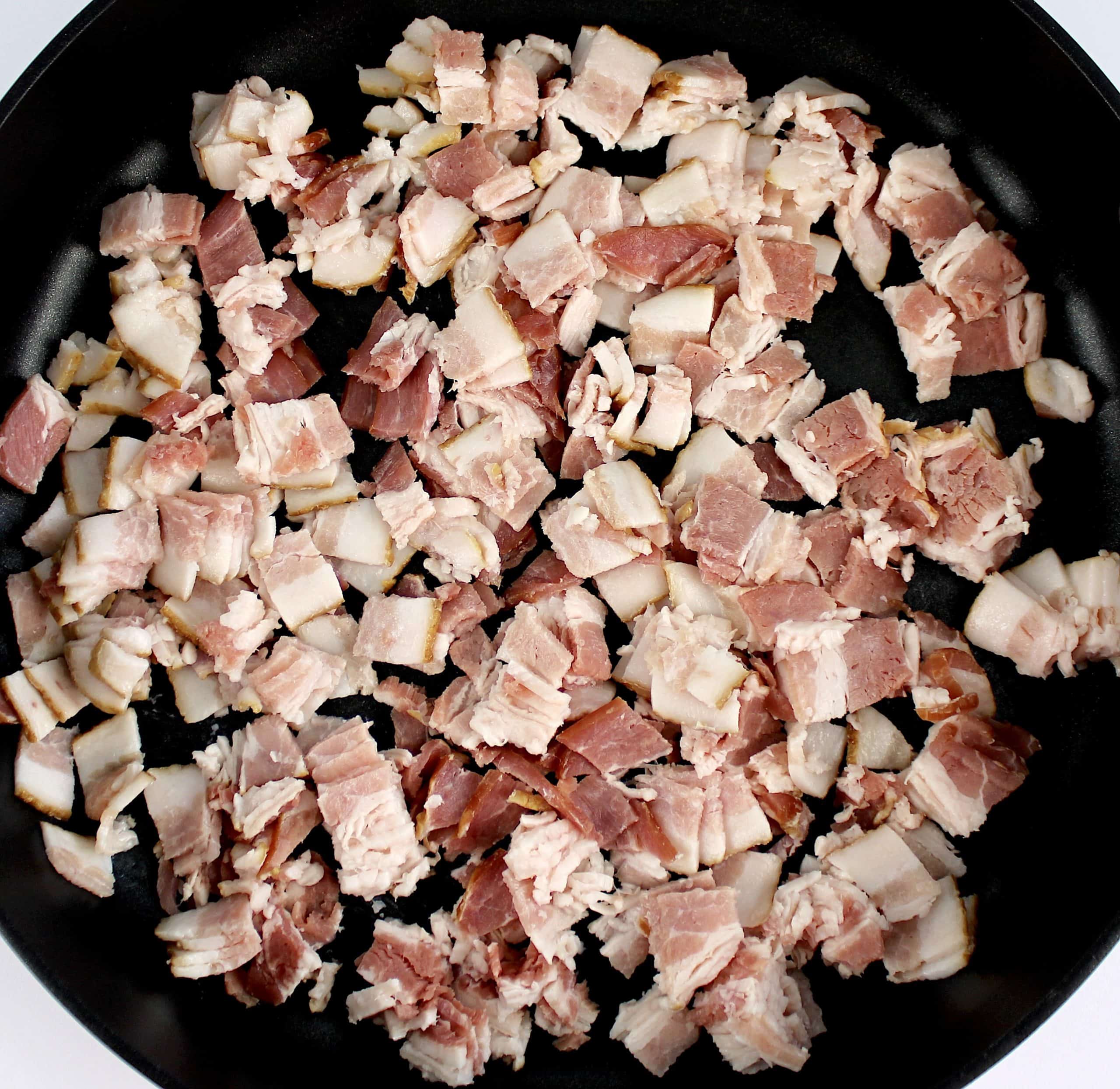 raw chopped bacon in skillet
