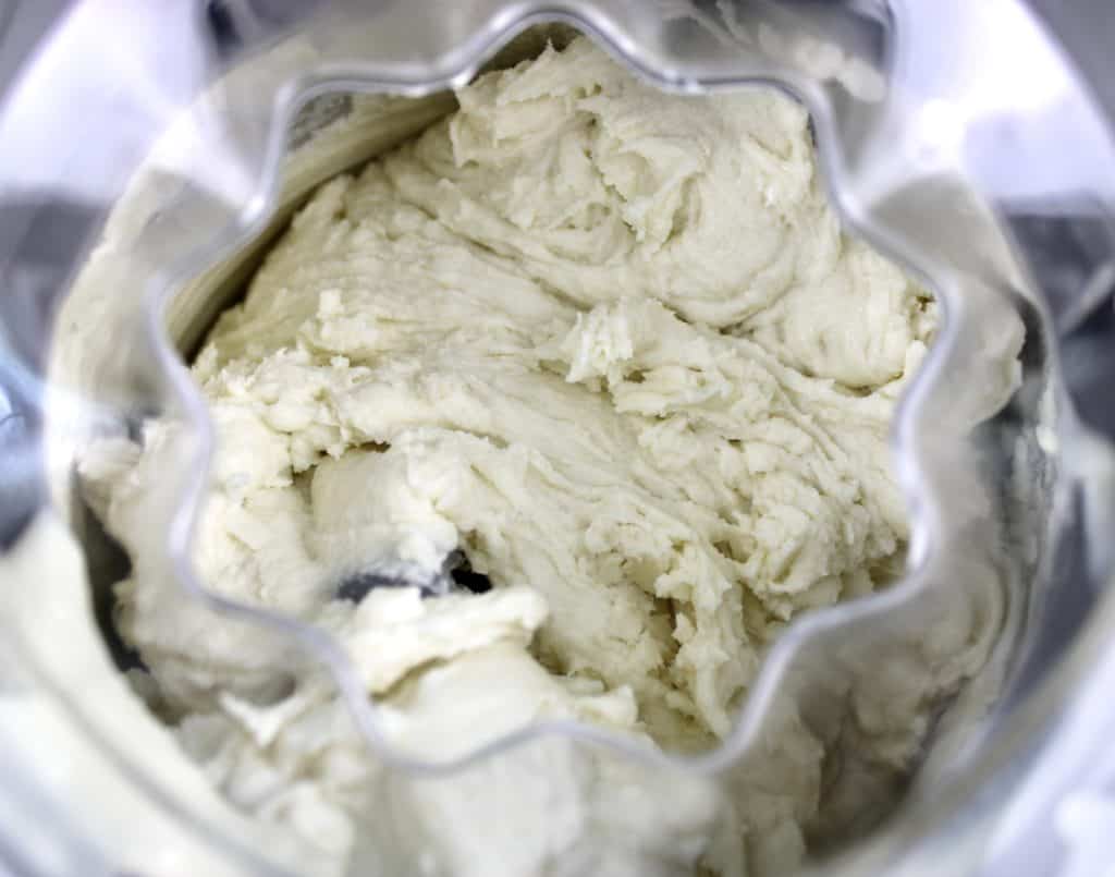 coconut ice cream in ice cream maker churning