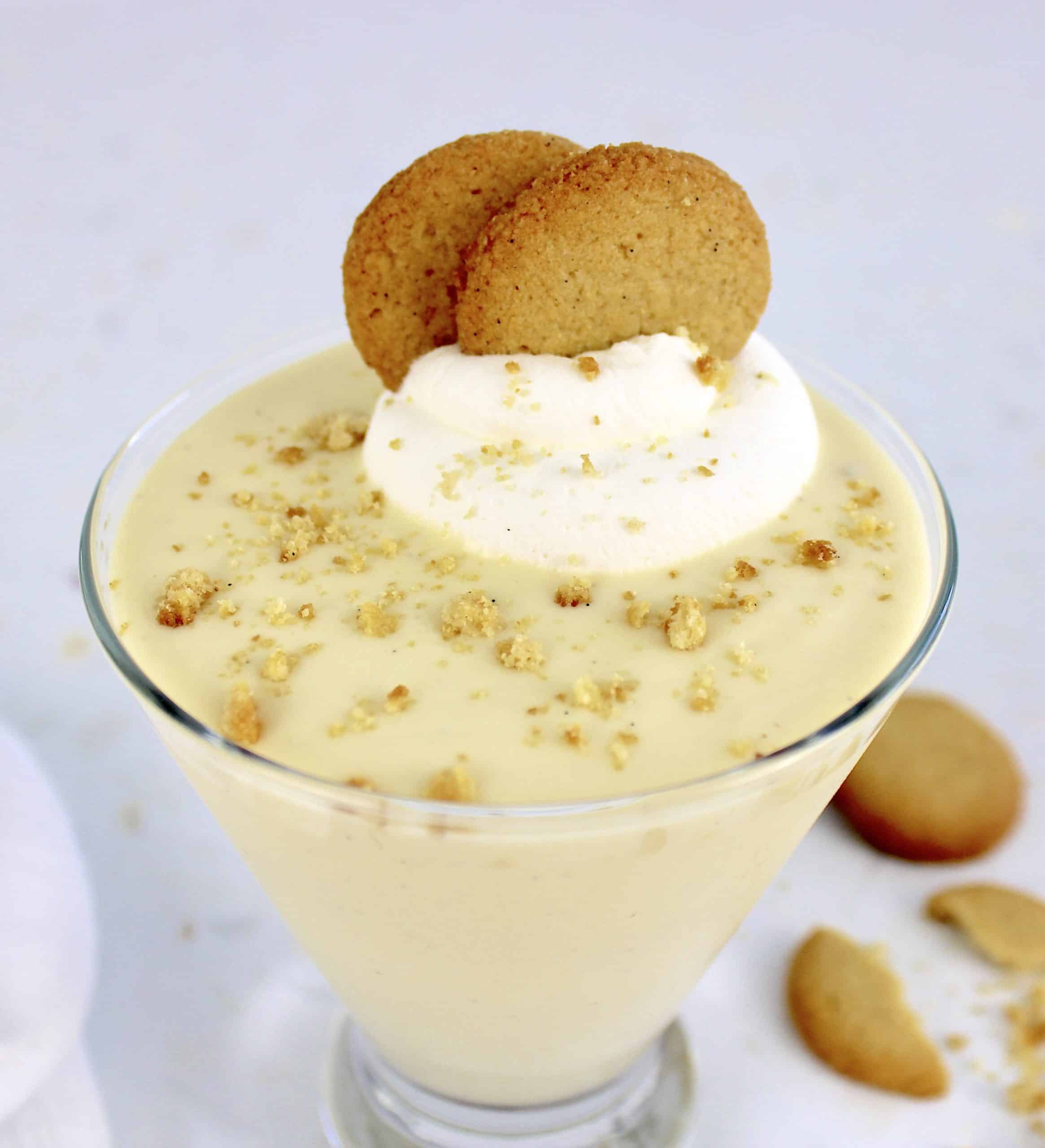 vanilla pudding in glass with nilla wafers and whip creamon top