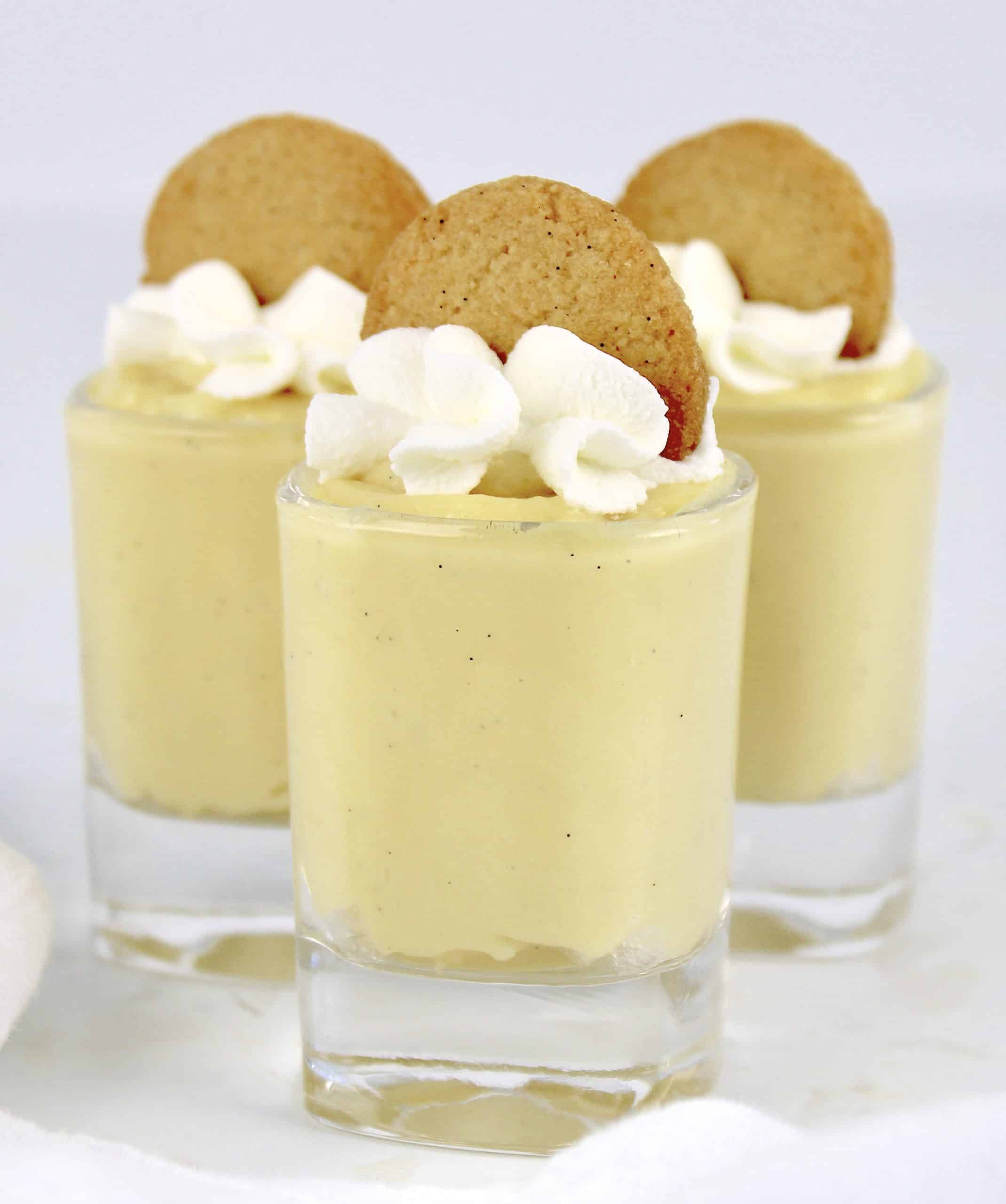 3 shot glasses with vanilla pudding with nilla wafers on top