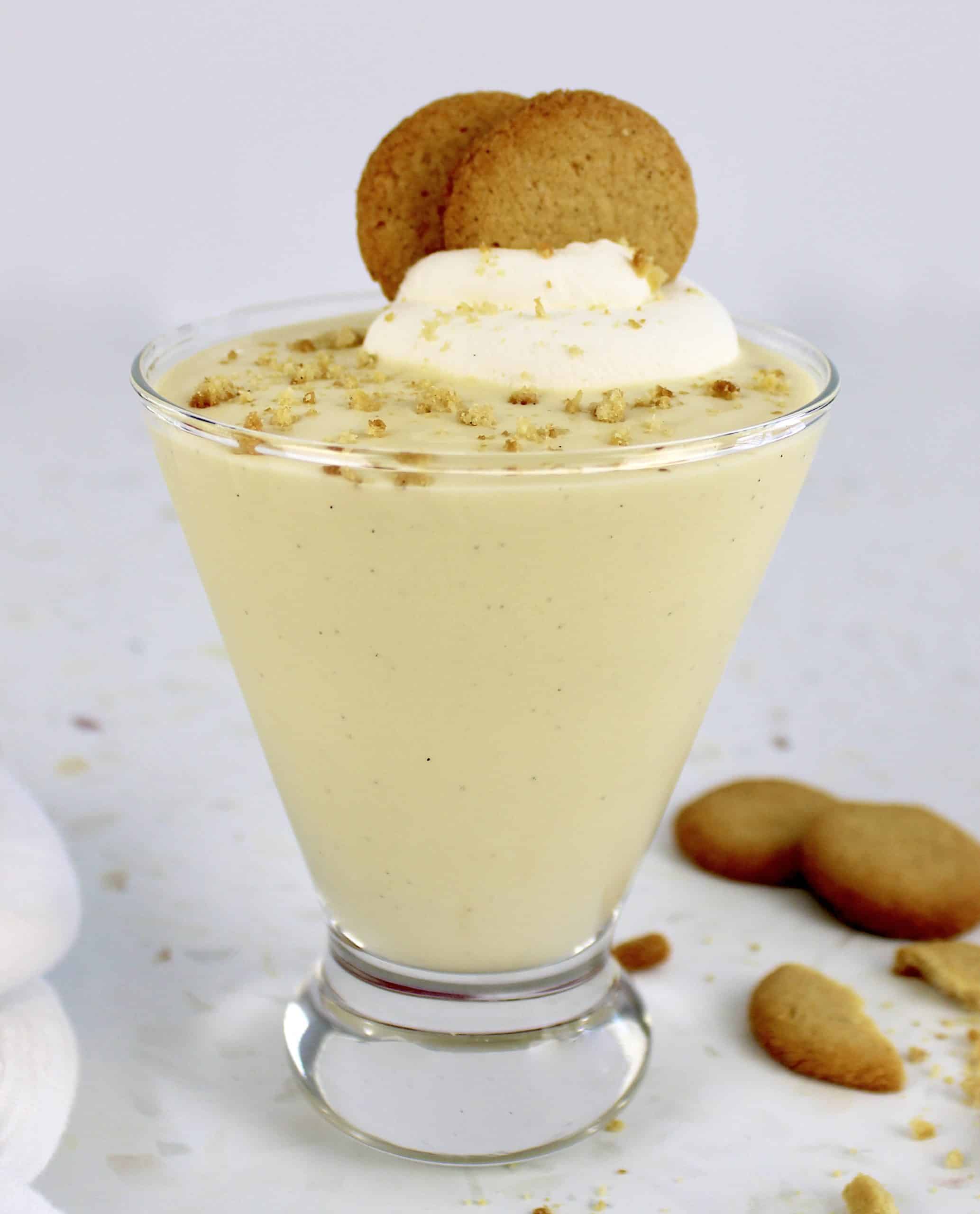 vanilla pudding in glass with whip cream and 2 nilla wafers on top