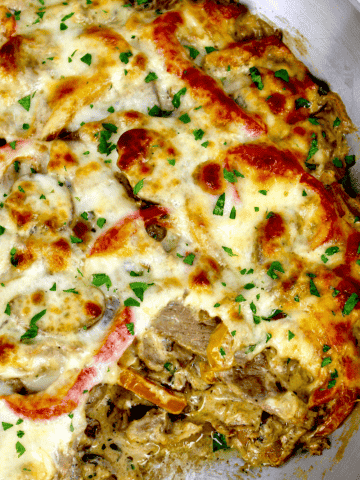 Philly Cheesesteak Casserole with piece missing