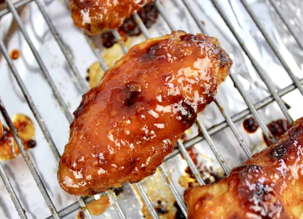 closeup of Sticky Asian Chicken Wing on baking rack
