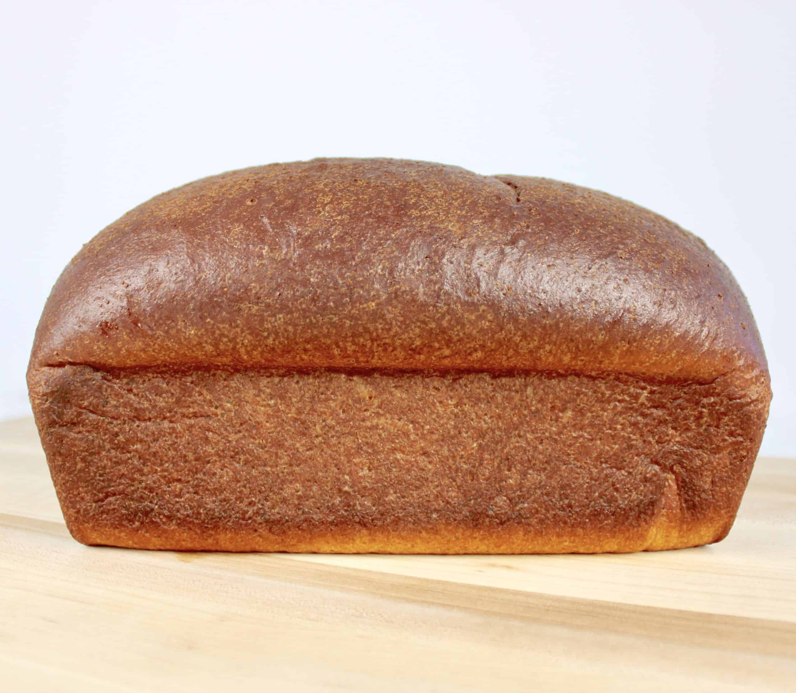 baked keto bread loaf on cutting board