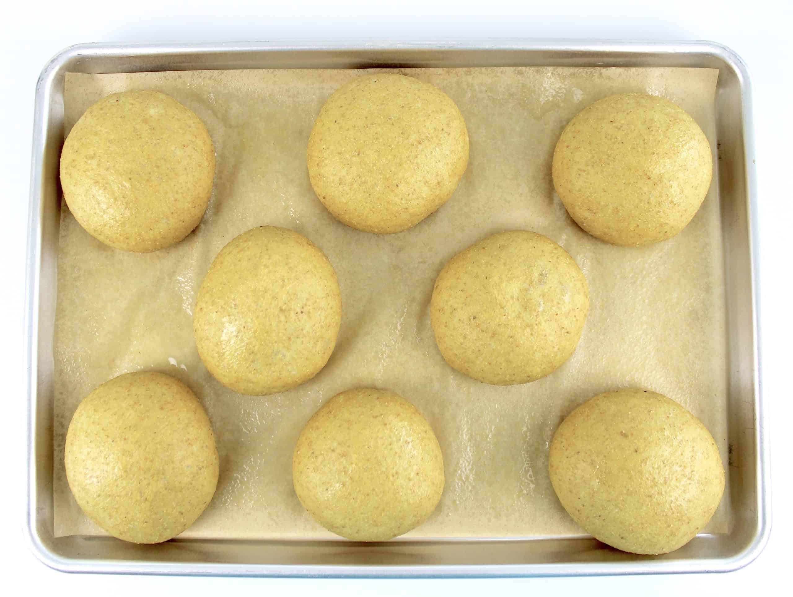 8 dough balls on parchment lined baking sheet