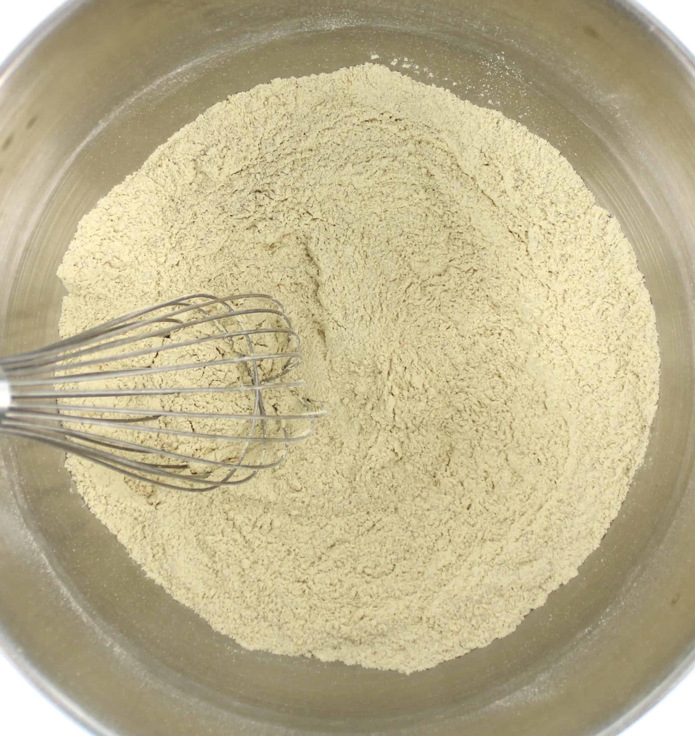 keto buns dry ingredients with whisk in mixer bowl