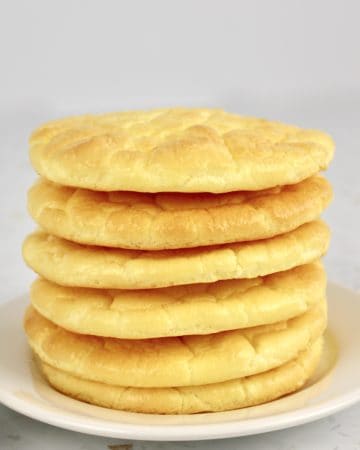 6 pieces cloud bread stacked up on white plate