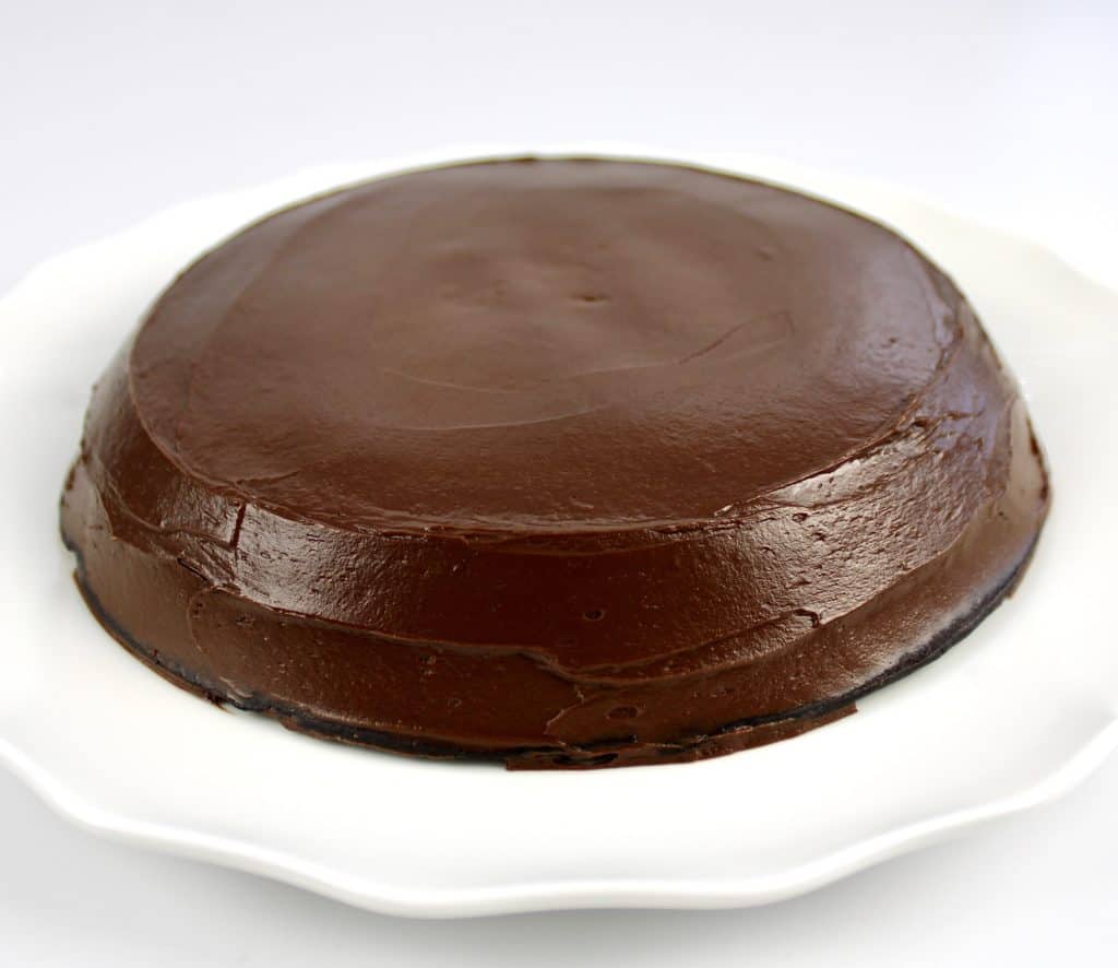 chocolate frosted cake on white plate