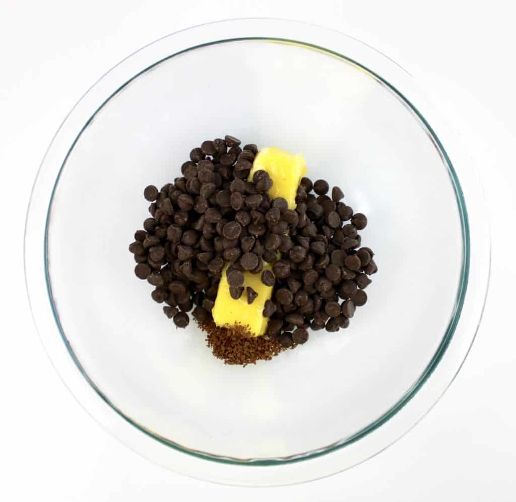 stick of butter and chocolate chips in glass bowl