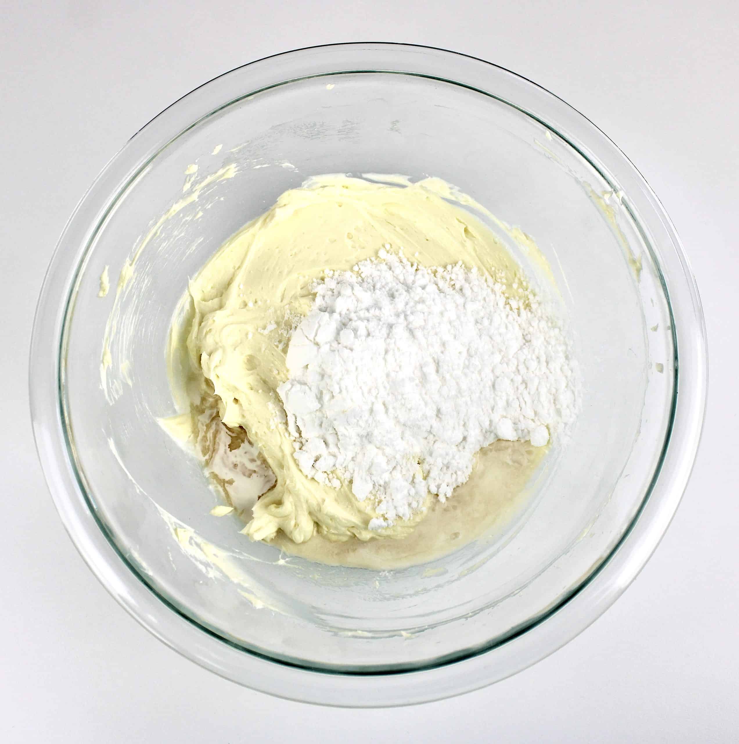 frosting and sweetener in glass bowl unmixed