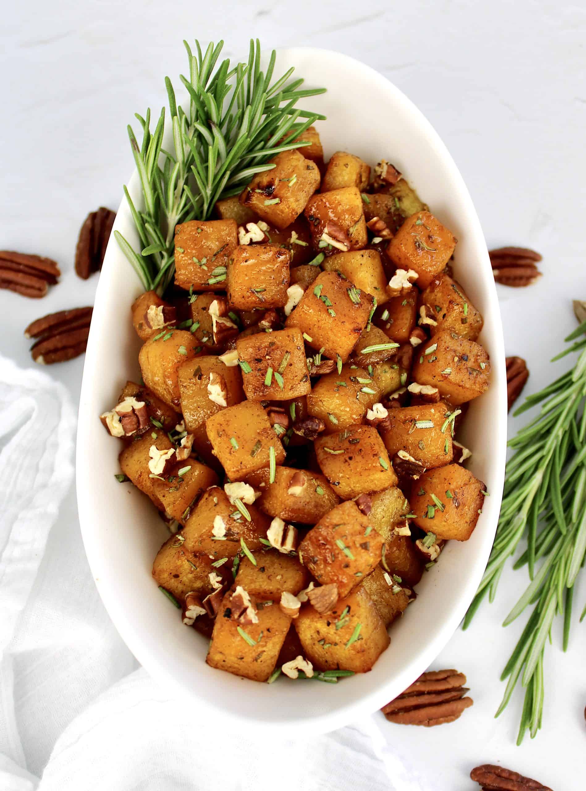 overhead view of Maple Roasted Butternut Squash with rosemary garnish