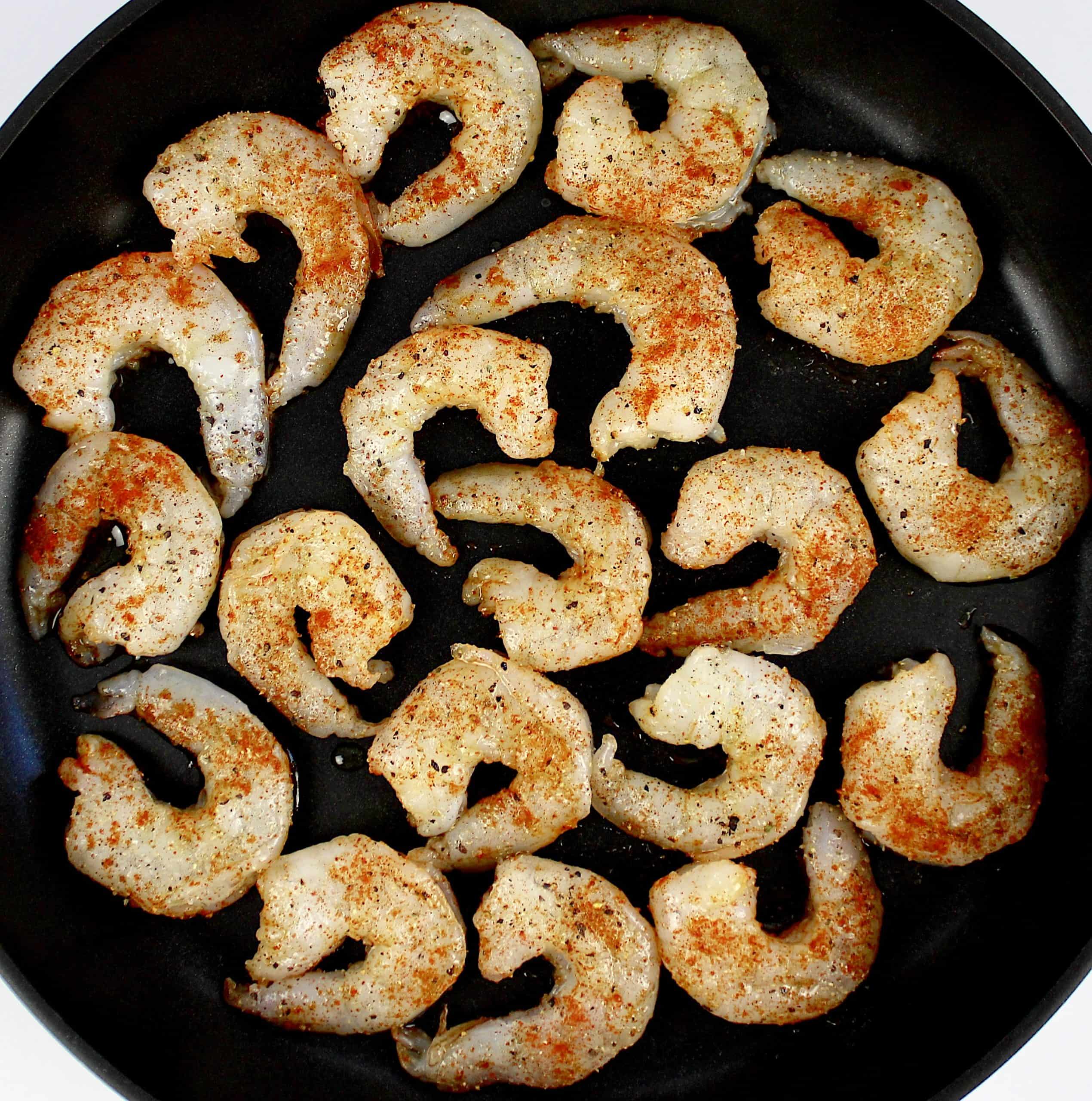 shrimp with spices cooking in skillet
