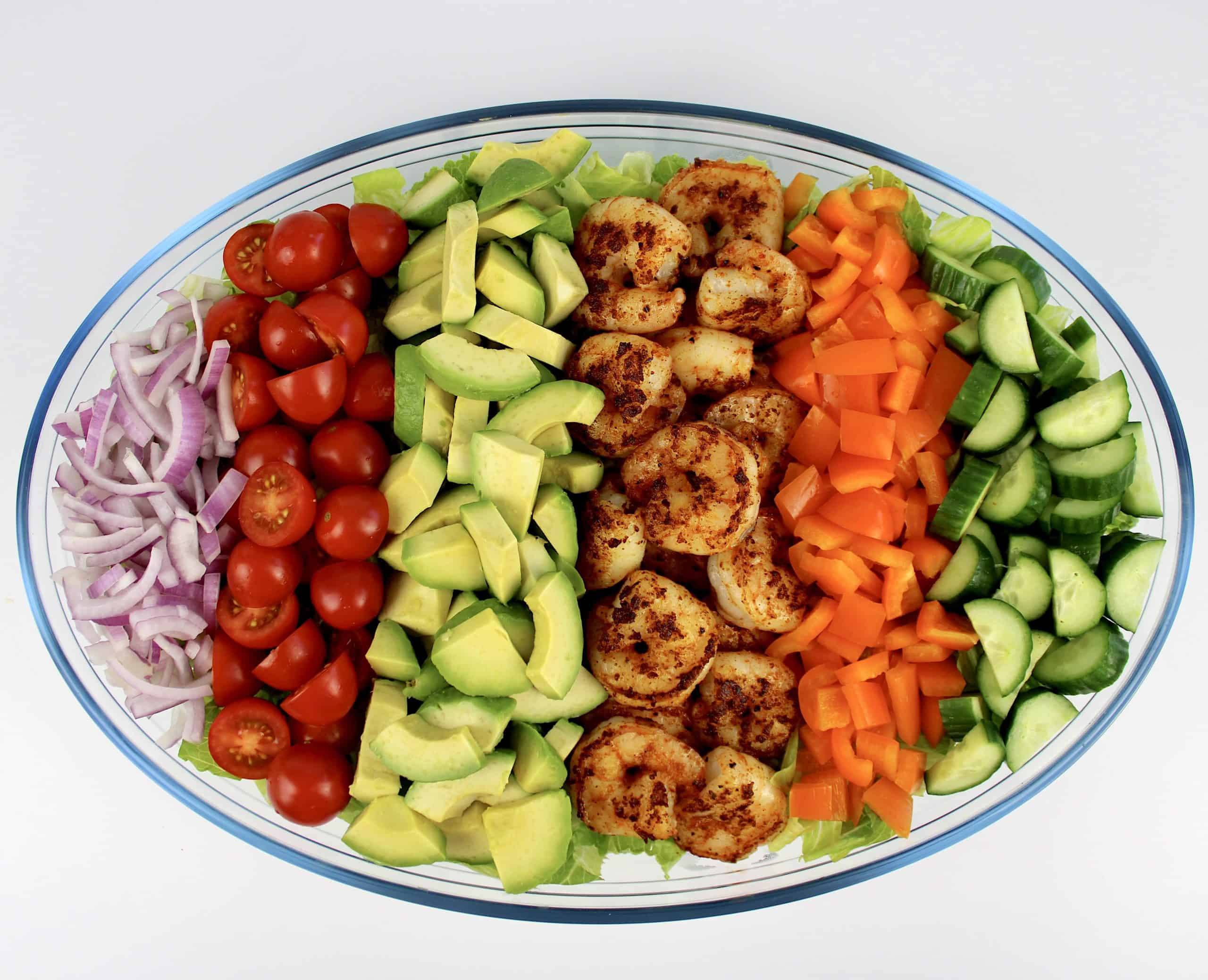Shrimp Avocado Salad with toppings in rows