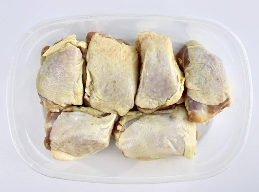 6 chicken thighs in plastic container