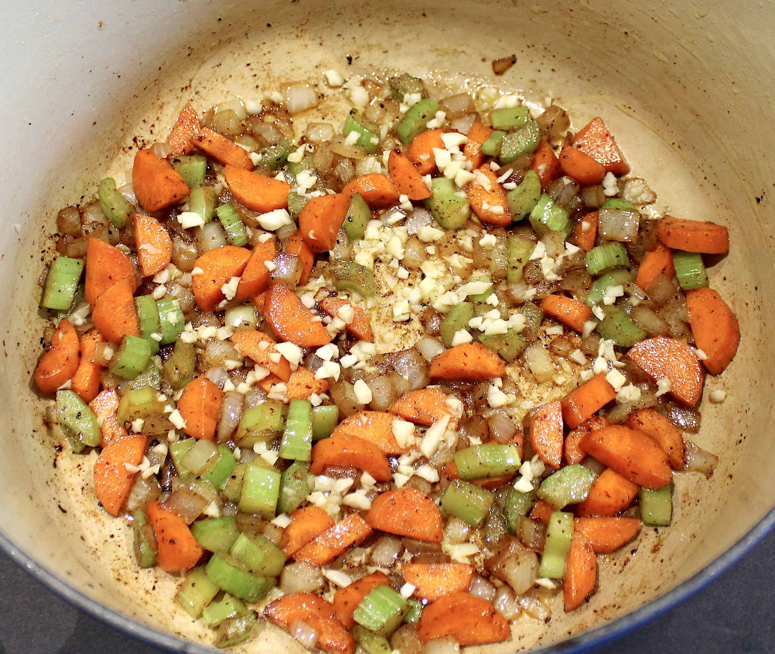carrots celery onion and garlic sautéed in pot