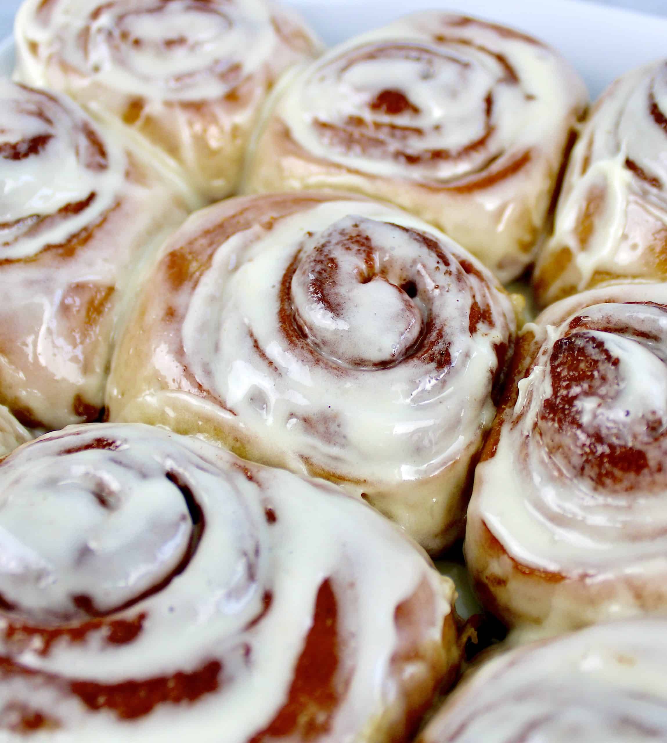 closeup of cinnamon rolls with icing