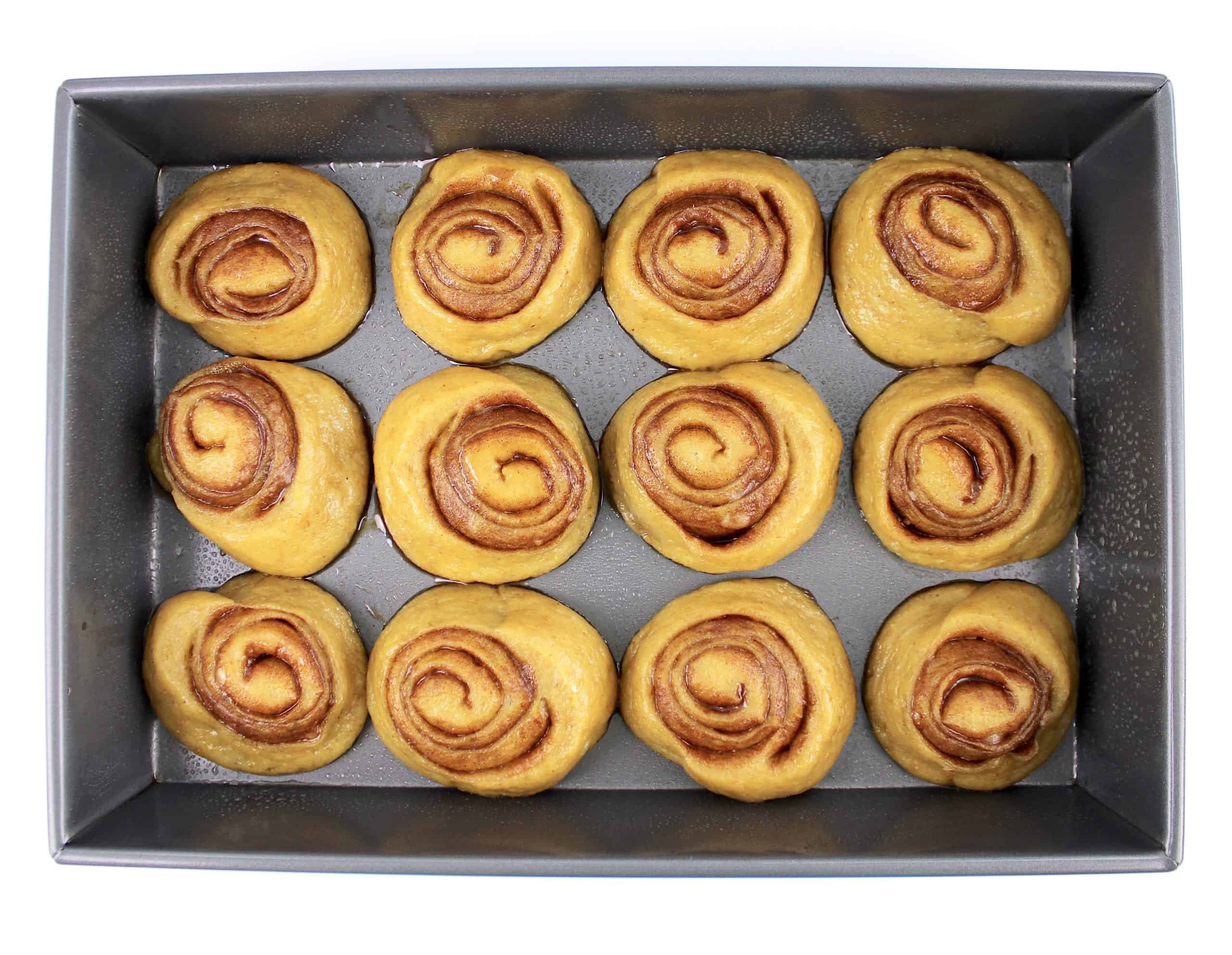 proof cinnamon rolls in baking pan unbaked