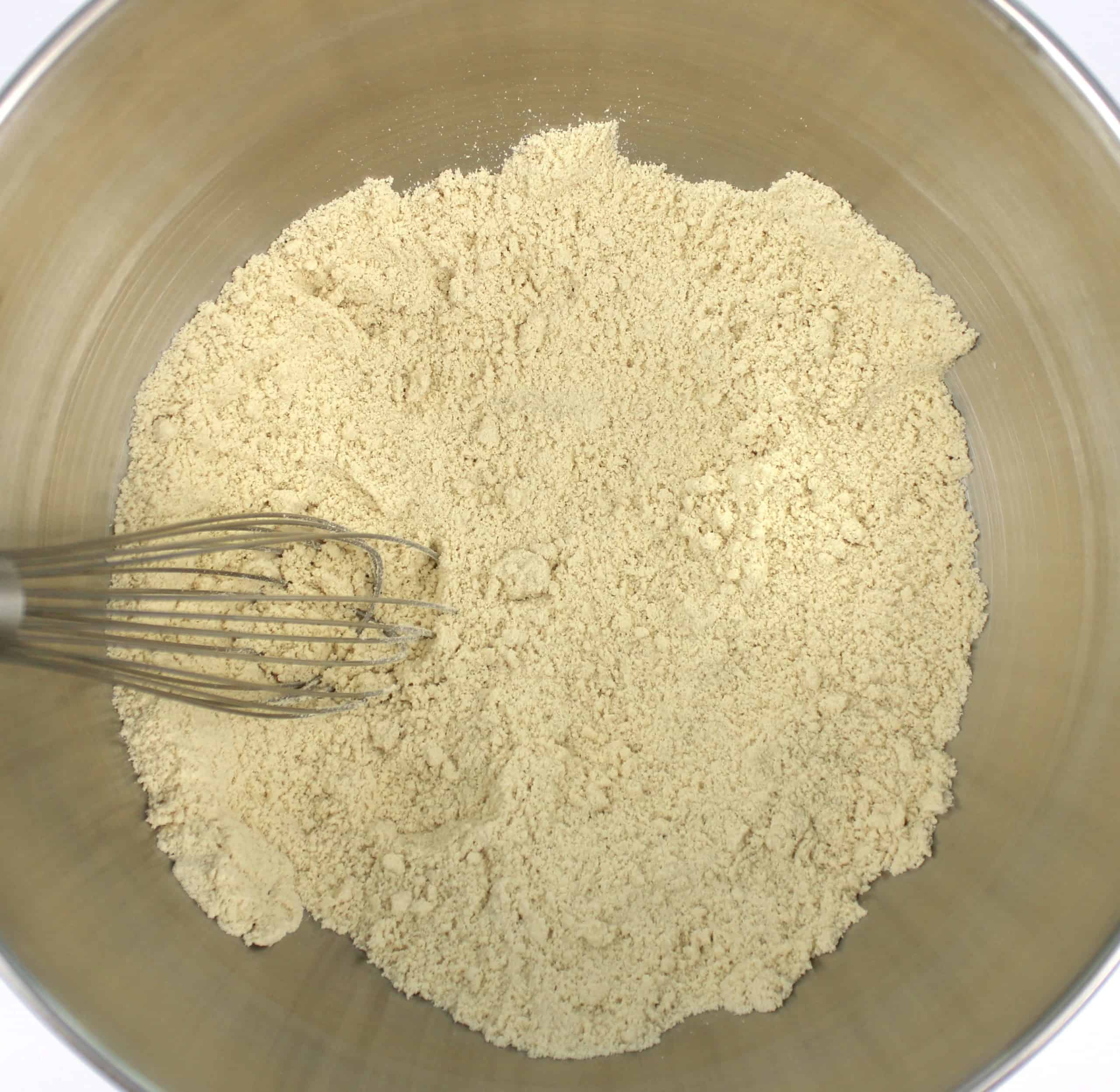 dry ingredients for keto tortillas in stand mixer bowl with whisk
