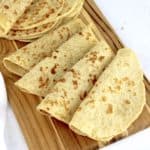 keto tortillas on wooden cutting board