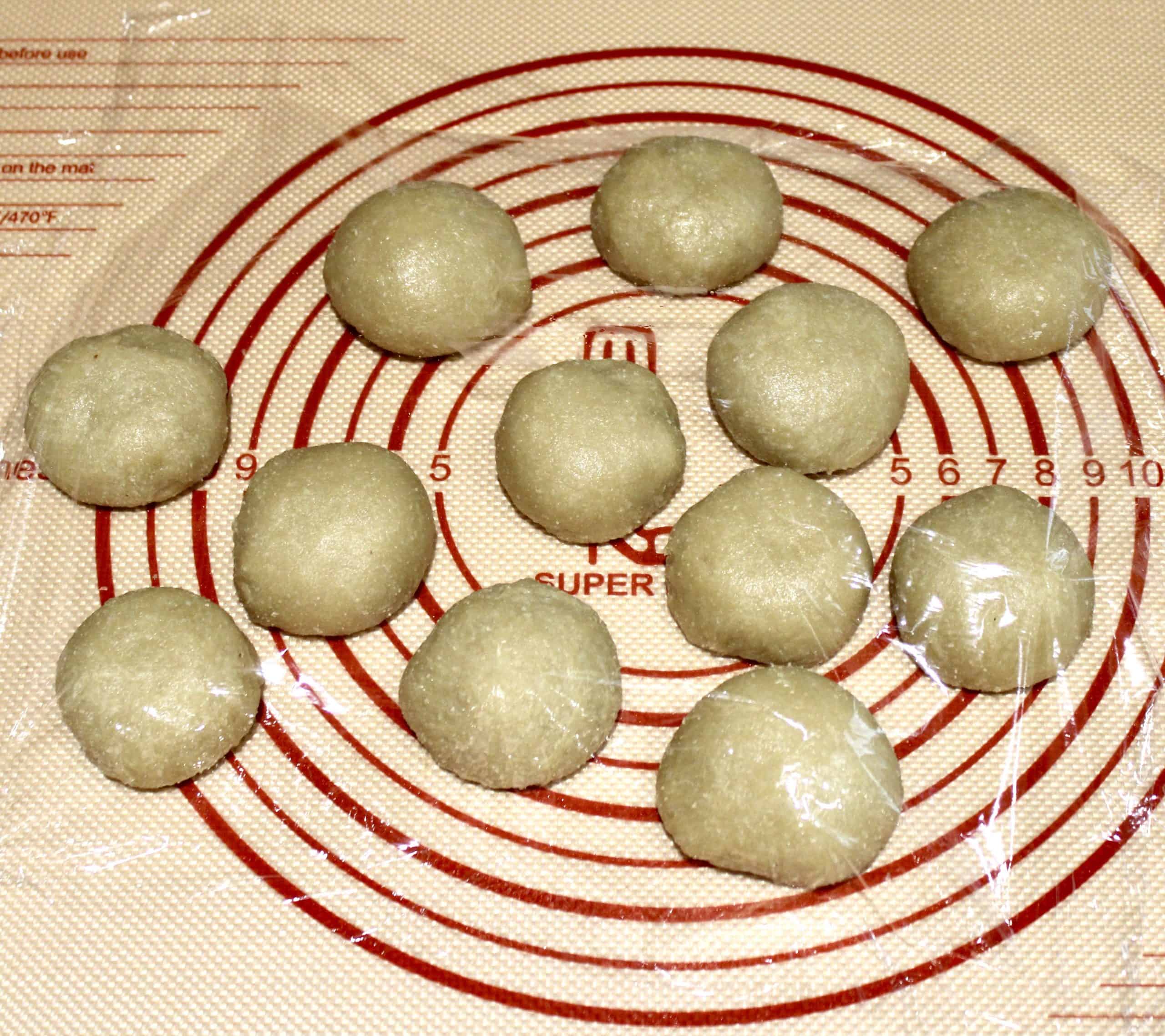 12 keto tortilla dough balls on silpat