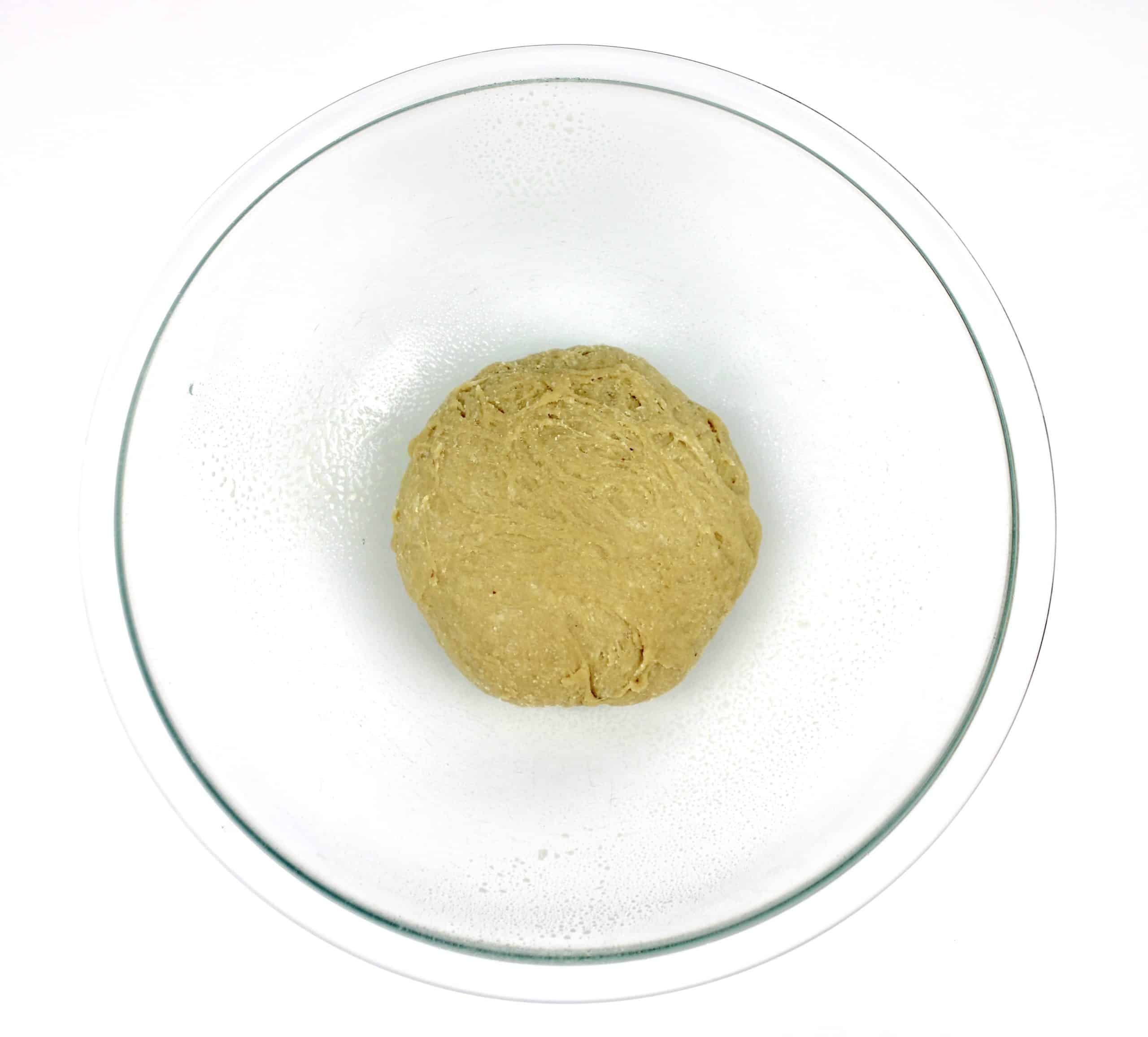 keto tortilla dough ball in glass bowl