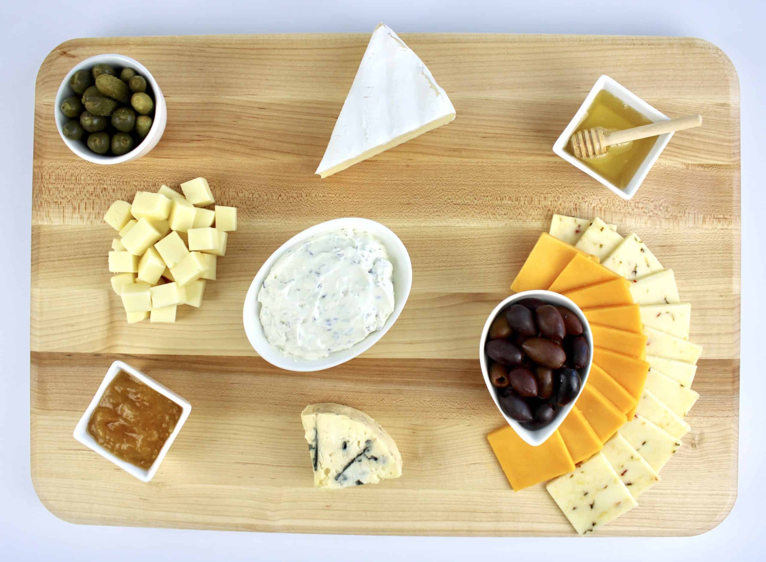 cheese board with cubes wedges and slices