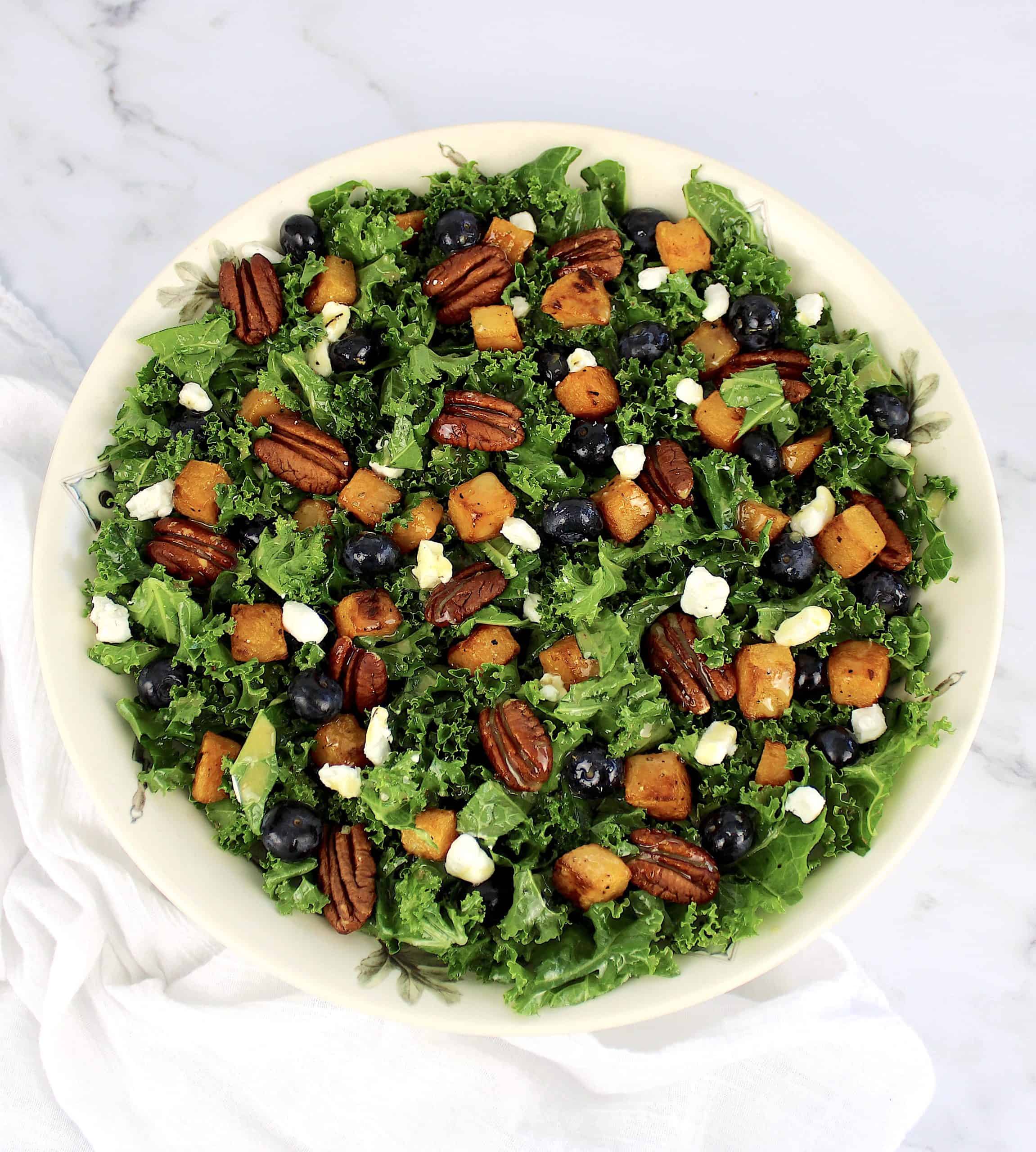 Kale Salad with Roasted Butternut Squash in white bowl