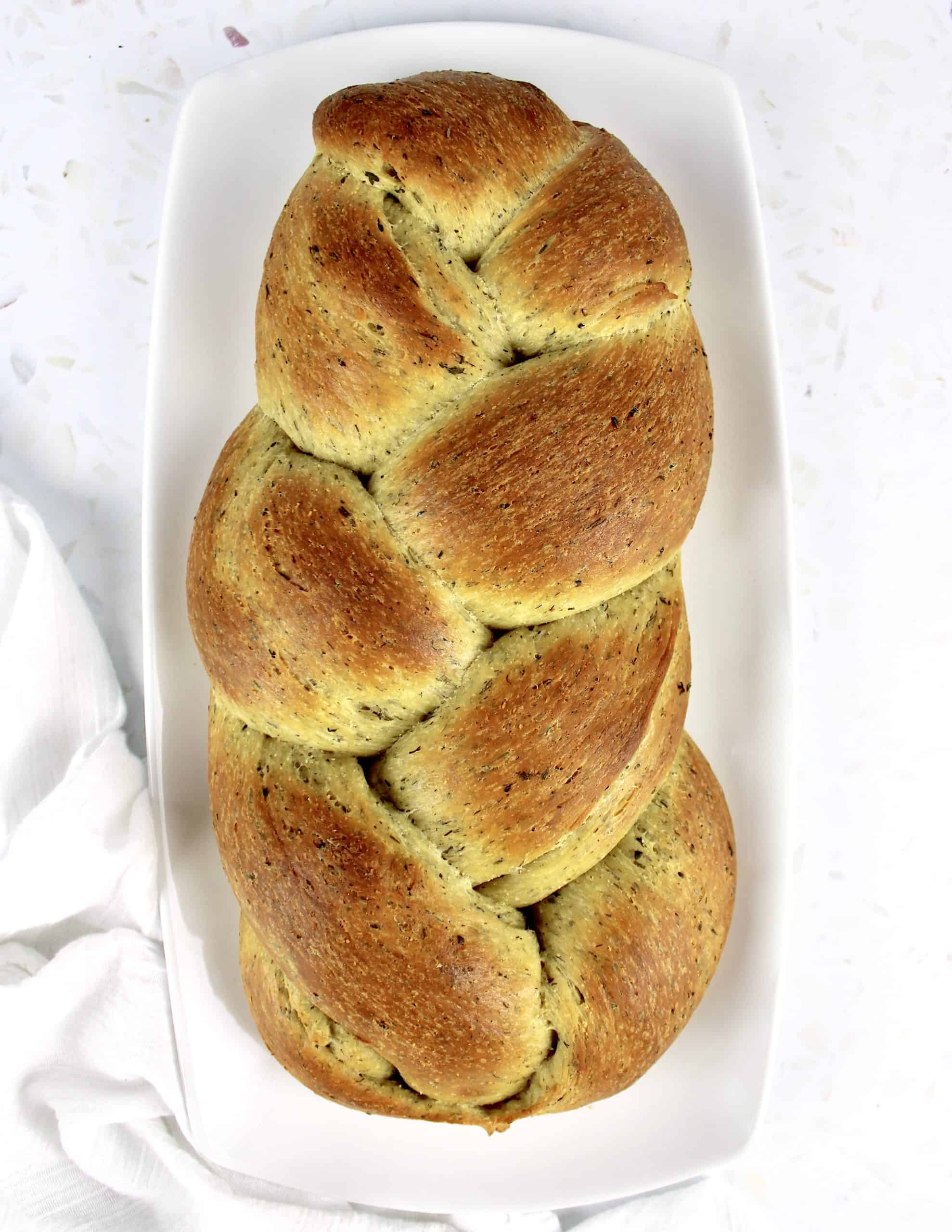 overhead view of Keto Braided Herb Bread on white plate