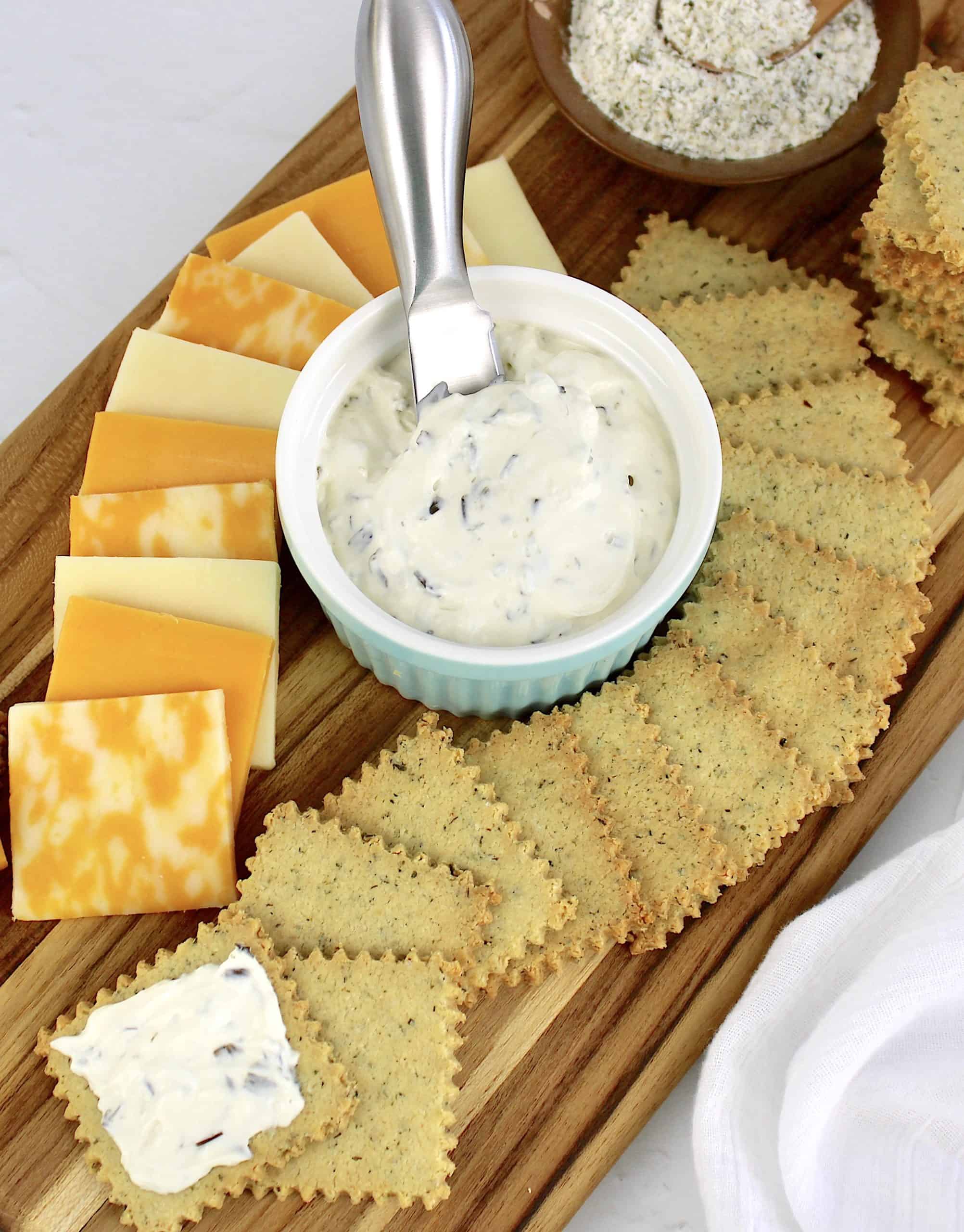 cheese board with spread and crackers