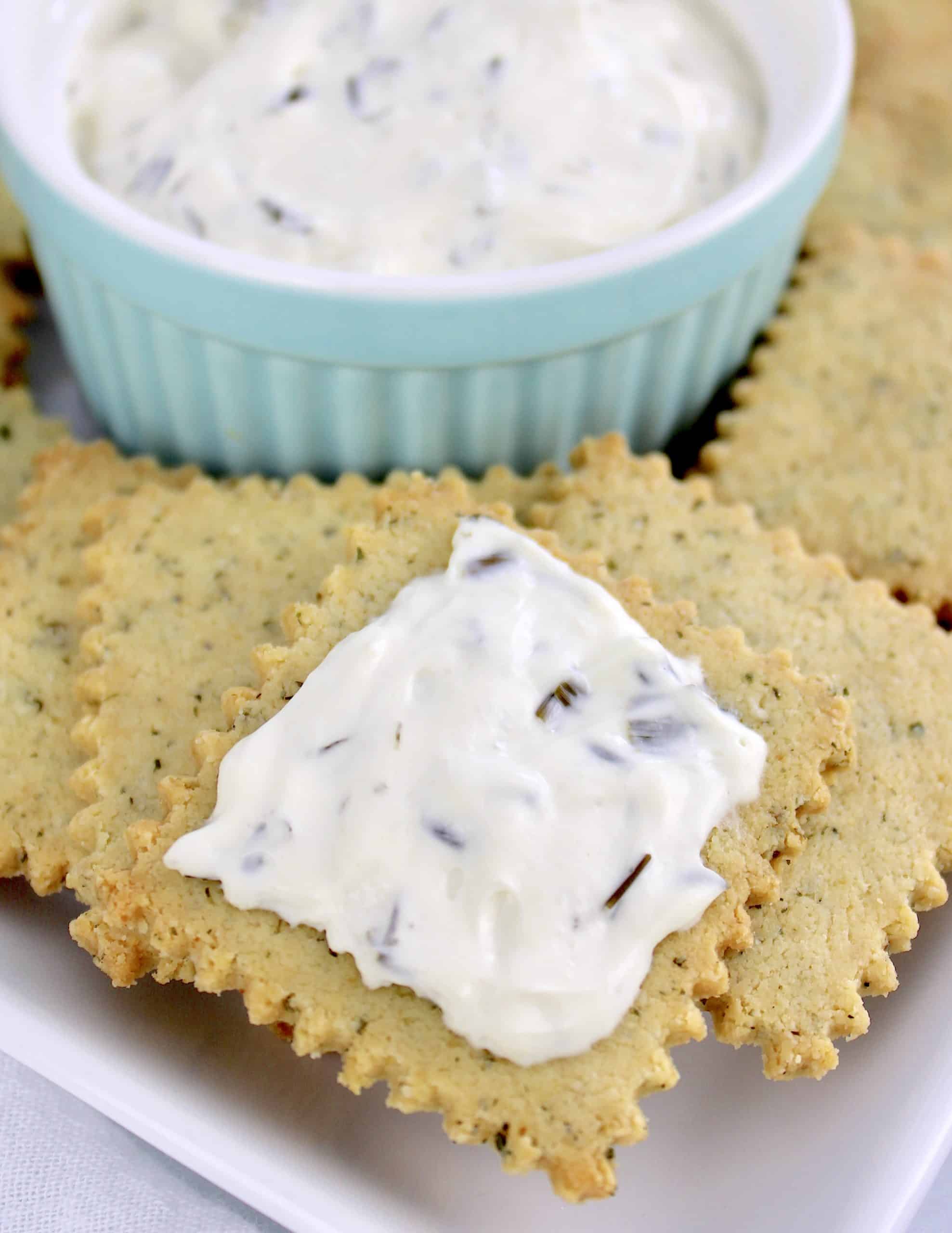 closeup of ranch crackers with cream cheese spread on top